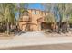 Stunning two-story home with a well-manicured lawn and mature trees providing curb appeal at 13672 W Chaparosa Way, Peoria, AZ 85383