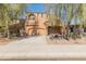 Inviting two-story home with a driveway and desert landscaping at 13672 W Chaparosa Way, Peoria, AZ 85383