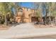 Beautiful two-story home with a well-maintained lawn and mature shade trees at 13672 W Chaparosa Way, Peoria, AZ 85383