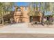 Charming two-story home with desert landscaping and mature trees enhancing curb appeal at 13672 W Chaparosa Way, Peoria, AZ 85383