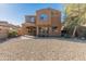 Beautiful two-story home with desert landscaping and an inviting arched entryway at 13672 W Chaparosa Way, Peoria, AZ 85383