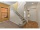 Grand foyer with staircase, tile flooring, and a bright entryway with natural light at 13672 W Chaparosa Way, Peoria, AZ 85383