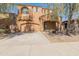 Two story home with an arched porch, a two car garage and drought resistant landscaping at 13672 W Chaparosa Way, Peoria, AZ 85383