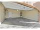 Clean and spacious two-car garage with ample storage space and an electric door at 13672 W Chaparosa Way, Peoria, AZ 85383