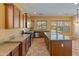 Modern kitchen with granite counters, stainless appliances, and a center island for extra prep space at 13672 W Chaparosa Way, Peoria, AZ 85383