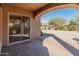 Covered patio with brick flooring and views of the backyard at 13672 W Chaparosa Way, Peoria, AZ 85383