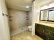 Modern bathroom featuring a walk-in shower, granite vanity, and updated fixtures at 1606 E Cactus Wren Dr, Phoenix, AZ 85020