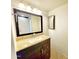 This bathroom features a granite-like vanity, a large mirror, and tile floors at 1606 E Cactus Wren Dr, Phoenix, AZ 85020