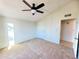 This bedroom features a ceiling fan and doors at 1606 E Cactus Wren Dr, Phoenix, AZ 85020