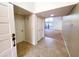 Bright foyer with tile flooring and a view into the spacious living area at 1606 E Cactus Wren Dr, Phoenix, AZ 85020