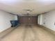Two-car garage with automatic door, concrete floor, and white walls at 1606 E Cactus Wren Dr, Phoenix, AZ 85020