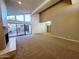 Spacious living room featuring a fireplace and access to the outdoor patio at 1606 E Cactus Wren Dr, Phoenix, AZ 85020
