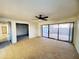 Open living room with large sliding glass doors providing ample natural light and courtyard access at 1606 E Cactus Wren Dr, Phoenix, AZ 85020