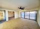 Open living room with large sliding glass doors providing ample natural light and courtyard access at 1606 E Cactus Wren Dr, Phoenix, AZ 85020