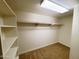 Walk-in closet with basic shelving and carpet at 1606 E Cactus Wren Dr, Phoenix, AZ 85020