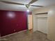 Bedroom with plush carpet, closet, and accent wall at 1638 W North Ln, Phoenix, AZ 85021