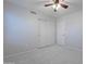 This bedroom has plush carpet, a ceiling fan, and a closet for storing belongings at 16671 W Mckinley St, Goodyear, AZ 85338