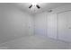Bedroom with neutral walls, carpet floors, ceiling fan, closet and door with white trim at 16671 W Mckinley St, Goodyear, AZ 85338