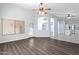 Bright and airy living room features wood floors and an open floor plan at 16671 W Mckinley St, Goodyear, AZ 85338