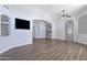 Spacious living room with an open floor plan and hardwood floors at 16671 W Mckinley St, Goodyear, AZ 85338