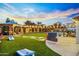 Vibrant backyard featuring a gazebo, pool, putting green, and outdoor games at 17614 N 56Th Way, Scottsdale, AZ 85254