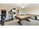 Spacious game room features a pool table, ping pong table, and fun arcade game at 17614 N 56Th Way, Scottsdale, AZ 85254