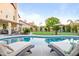 Gorgeous in-ground pool area surrounded by manicured lawn and an inviting outdoor seating area at 17614 N 56Th Way, Scottsdale, AZ 85254