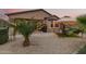 Private backyard features desert landscaping, a cozy seating area, a built in grill, and a gazebo at 17938 W Cedarwood Ln, Goodyear, AZ 85338