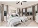 Inviting bedroom featuring two beds, soft carpeting, and ample natural light at 17938 W Cedarwood Ln, Goodyear, AZ 85338