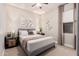 Cozy bedroom with a ceiling fan, neutral decor, soft lighting, and comfortable furniture at 17938 W Cedarwood Ln, Goodyear, AZ 85338