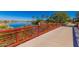 Picturesque bridge over a calm lake with vibrant plant life, highlighting the community's outdoor space at 17938 W Cedarwood Ln, Goodyear, AZ 85338