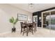 Casual dining area with a modern chandelier and a sliding glass door at 17938 W Cedarwood Ln, Goodyear, AZ 85338