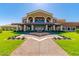 Elegant building with a fountain and manicured grounds, showcasing the community's upscale amenities at 17938 W Cedarwood Ln, Goodyear, AZ 85338