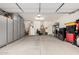 Spacious three car garage with ample storage cabinets for organized parking and storage solutions at 17938 W Cedarwood Ln, Goodyear, AZ 85338