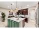 Bright kitchen with eat-in island, stainless steel appliances, and plenty of cabinet space at 17938 W Cedarwood Ln, Goodyear, AZ 85338