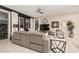 Comfortable living room with contemporary furnishings and a ceiling fan at 17938 W Cedarwood Ln, Goodyear, AZ 85338