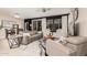Spacious living room with a large window and neutral-toned furnishings at 17938 W Cedarwood Ln, Goodyear, AZ 85338