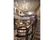 Lobby area with staircase and comfortable seating, creating a welcoming and sophisticated atmosphere at 17938 W Cedarwood Ln, Goodyear, AZ 85338