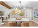 Elegant dining room with modern lighting, seating for four, and stylish decor at 1825 N Granite Reef Rd, Scottsdale, AZ 85257
