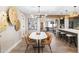 Inviting dining area with a modern chandelier, seating for four, and decorative wall accents at 1825 N Granite Reef Rd, Scottsdale, AZ 85257