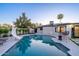 Backyard pool with a slide, and outdoor seating near the modern home at 1825 N Granite Reef Rd, Scottsdale, AZ 85257