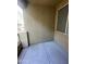 A small outdoor balcony features a concrete floor, and tan stucco walls at 1920 E Bell Rd # 1188, Phoenix, AZ 85022