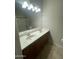 A bathroom with a double sink vanity, a large mirror, and a view of a bath tub with a shower at 1920 E Bell Rd # 1188, Phoenix, AZ 85022
