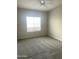 Bedroom with gray walls, soft carpet, and natural light from a window at 1920 E Bell Rd # 1188, Phoenix, AZ 85022