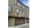 Townhouse exterior view featuring a balcony, garage, and stucco facade at 1920 E Bell Rd # 1188, Phoenix, AZ 85022