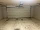 Spacious two-car garage with ample room for parking and storage featuring a neutral painted floor at 1920 E Bell Rd # 1188, Phoenix, AZ 85022