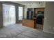 Living room open to the kitchen featuring an island and sliding glass door at 1920 E Bell Rd # 1188, Phoenix, AZ 85022
