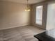 Living area with plush carpeting, bright light fixtures, and slider door at 1920 E Bell Rd # 1188, Phoenix, AZ 85022