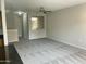 Open living room with island, neutral paint, and large windows at 1920 E Bell Rd # 1188, Phoenix, AZ 85022