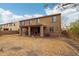 Backyard features a covered patio, red Adirondack chairs surrounding a firepit, and a barbecue grill at 20916 E Via De Arboles --, Queen Creek, AZ 85142